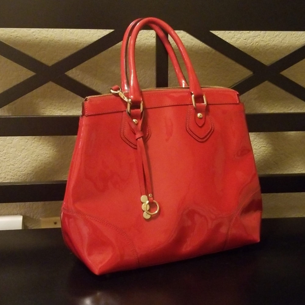 Beautiful real, red Asia Bellucci bag.